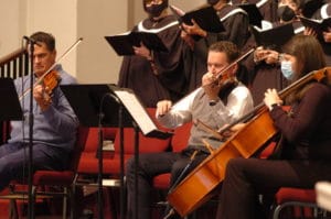 People playing their instruments during the church service.