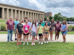 Youth Choir posing for a picture while they are on a field trip