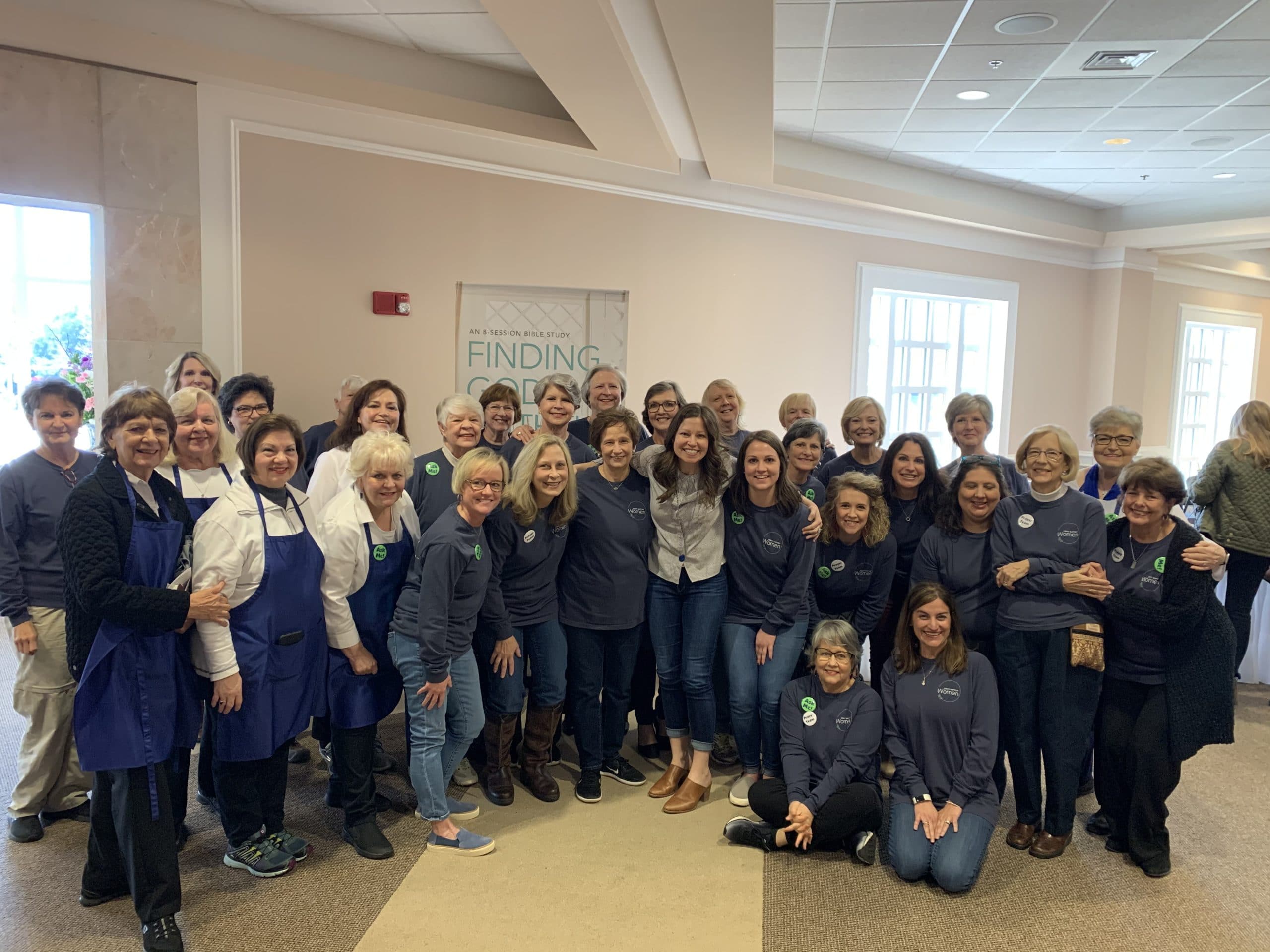 Womens ministry posing for a picture in matching shirts